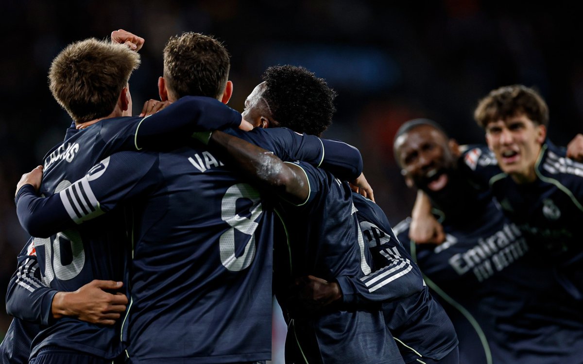 Real Madrid stays in title race as deflected goal gives late win in Vigo